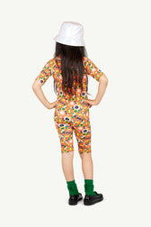Image featuring a girl wearing a floral jumpsuit by The Animals Observatory. The image shows the back of the jumpsuit.