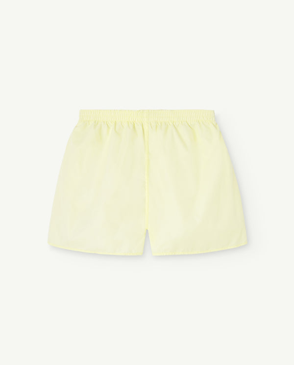 Image of yellow shorts for kids. The image shows the shorts from the back.